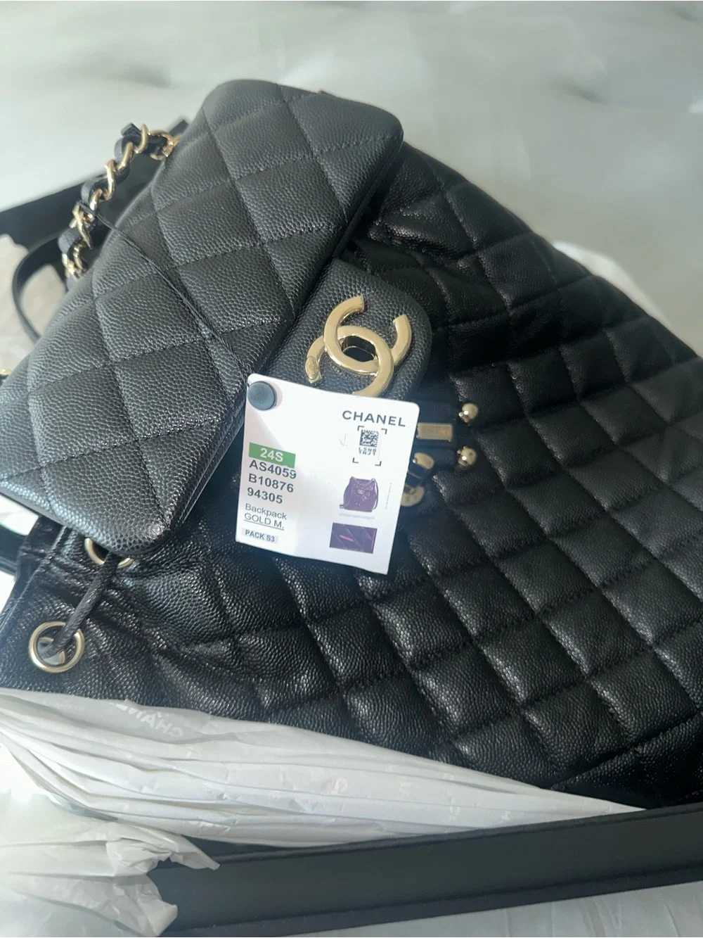 CHANEL Black Quilted Leather Drawstring Backpack with Gold CC